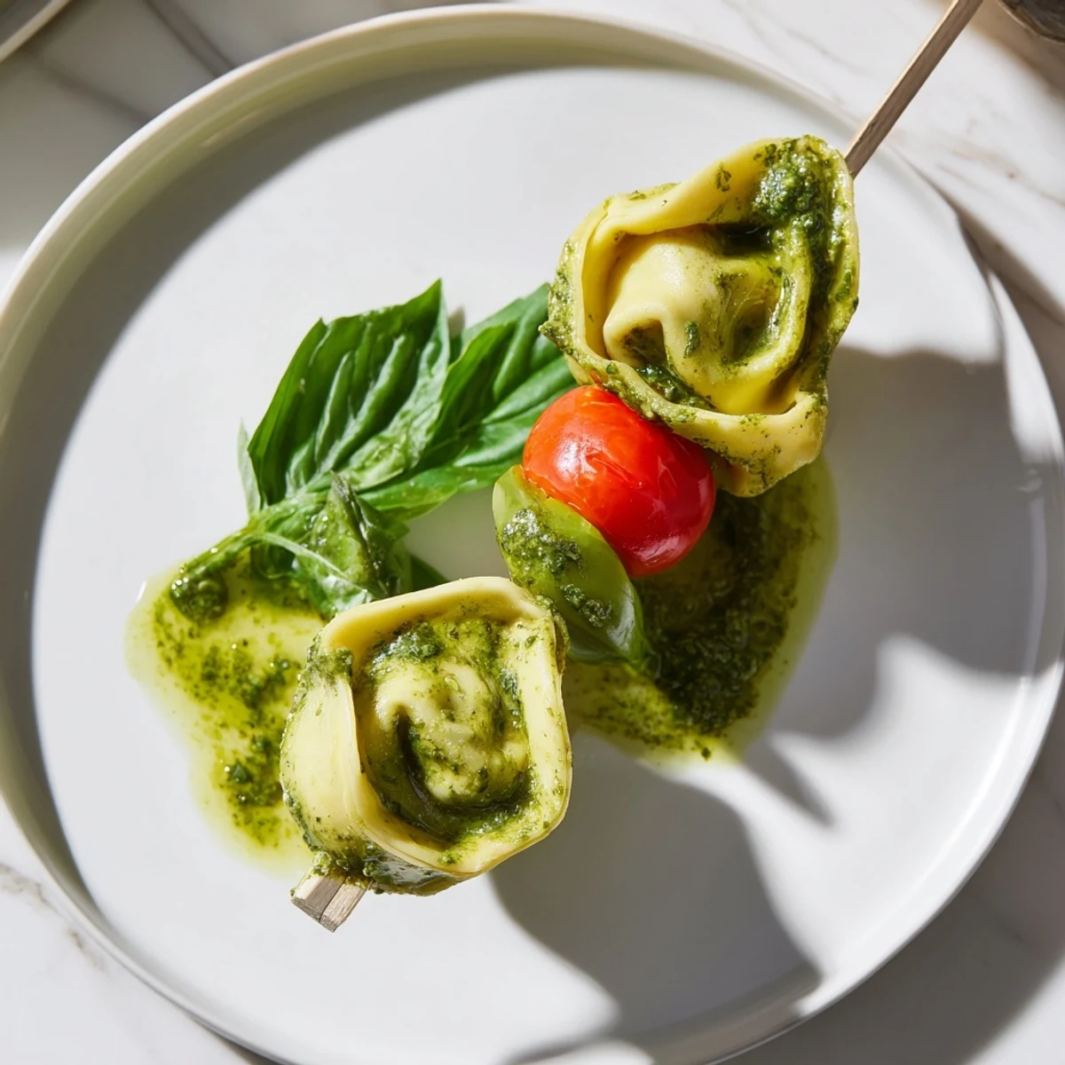 Enjoy delicious Tortellini, pesto, and olive appetizer skewers, bursting with Italian-inspired flavors.