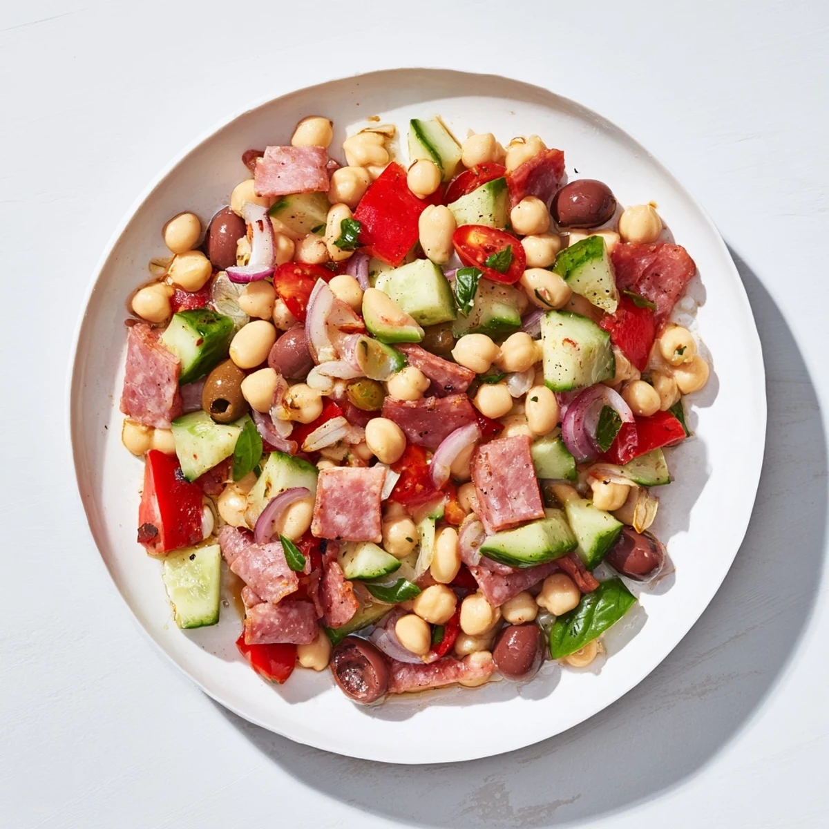 Mediterranean Dense Bean Salad with salami, a vibrant, colorful salad, ready to eat.