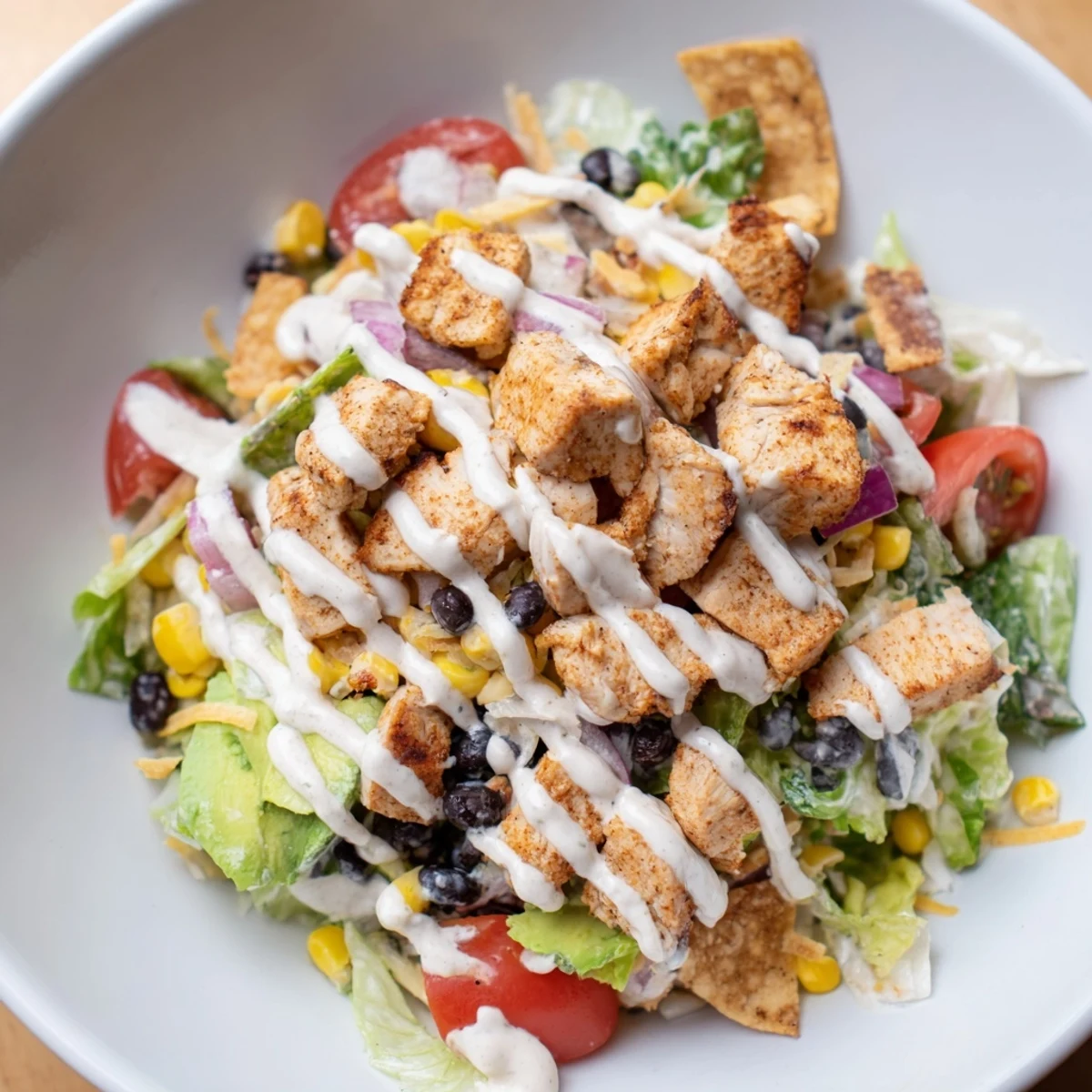 Enjoy a refreshing Chicken Taco Chopped Salad with juicy chicken and crunchy tortilla chips in every bite.