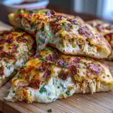 Grilled Ranch Crack Chicken Stuffed Naan wedges served with fresh chives and ranch dip