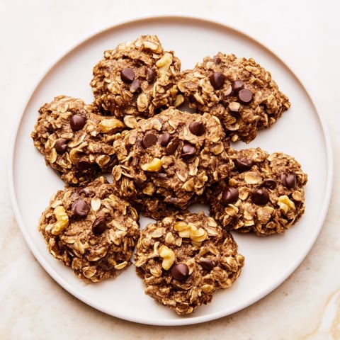 Soft, golden Banana-Oat Cookies fresh from the oven, offering a wholesome treat texture.