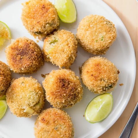 Golden brown Pickle Margarita Croquetas offer a delicious fusion of tangy tastes.  
