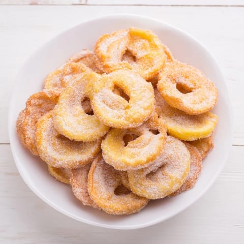 Warm Budget Torrijas, showcasing a close-up, crispy texture, perfect for a sweet breakfast.